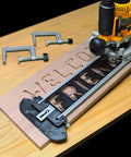 Sign Making Router Kit With 2.5 Inch And 1.5 Inch Horizontal Letters And 1.5 Inch And 2.5 Inch Vertical Numbers, router on wooden board
