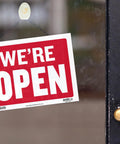Open And Closed Sign 12x16 Inch Double Sided Vinyl Sign For Storefronts Offices Restaurants Bars Shops Waterproof Indoor Signage With Bold Lettering No Sweat For Window Doors Front Desk And Lobbies 1 Pack showing 'WE'RE OPEN'