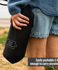 Person holding Ultra Lightweight Compact Camping Chair With Low Back Minimalist Design Folds Into Small Carry Bag