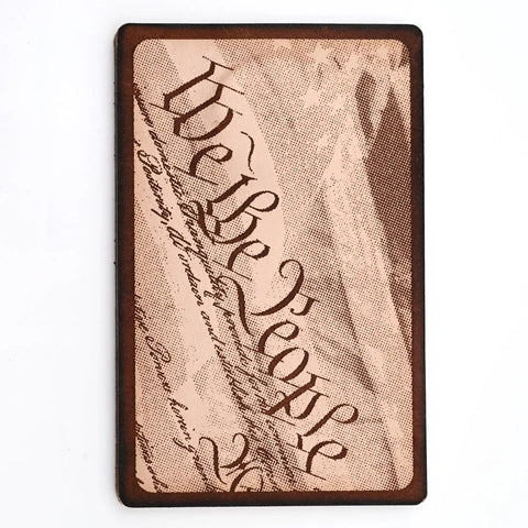 Leather card holder featuring a laser-engraved "We the People" design on the front