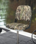 Padded Folding Boat Seat With Backrest For Bass Boats, camo design, dockside ready, mounted on boat deck, for fishing trips.