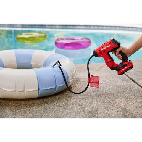 V20 Cordless Tire Inflator And Portable Air Compressor inflating a pool float by a swimming pool.