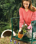 Woman using Versatile Garden Kneeler And Seat Foldable Bench With Tool Pouch And Soft Kneeling Pad in garden