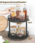 Two Pack Two Tier Lazy Susan Organizer Smooth Rotating Metal Turntable, showcasing jars with lids on a black metal carousel.