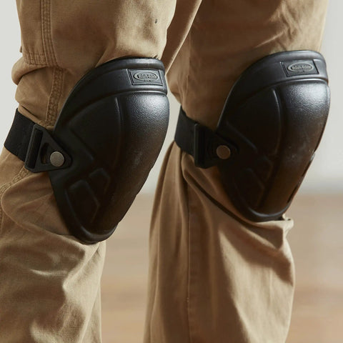 1MN-350 Tuff Shell Knee Pads with lightweight ergonomic EVA foam liner worn on knees, black all-weather design