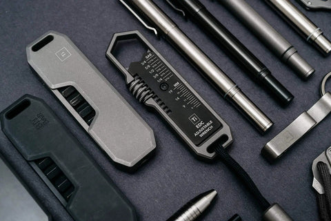 Top view of Titanium EDC Wrench for Everyday Carry with One Handed Operation Removable Pocket Clip Paracord Lanyard and Key Ring Universal 25 Size SAE and Metric Wrench Set in Silver.