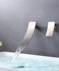 Wall Mount Waterfall Bathroom Faucet In Brass Chrome Finish With Solid Brass Body, Smooth Flow 1.2 GPM pouring into sink