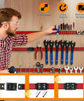 Person using 18-Inch Magnetic Tool Holder Strip Set, 4-Piece Red Metal Tool Organizer Rack With Stainless Steel Surface, Magnetic Bars For Garage Or Workshop, Easy To Install With Mounting Screws And Connectable Design