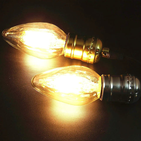 Close-up of 8W LED Porch Light Bulb Dimmable 2700K Warm White E26 Base Outdoor Post Light For Ceiling Fans And Lanterns Vintage Filament Wrinkle Glass 75W 80W Equivalent No Brainer 4 Pack in glowing operation showcasing wrinkle glass and filament design.