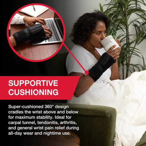 Image of a person wearing an Adjustable Night Wrist Brace For Sleep With Comfy Cushioned Support And 360 Degree Coverage Left Or Right Fit One Size Fits Most Black Gentle Arm Compression For Pain Relief And Comfort, sitting on a couch while drinking a beverage.