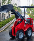 Versatile Mini Crawler Skid Steer Loader With Hydraulic Cylinder parked on a wet street, showing raised wear-resistant bucket and compact design