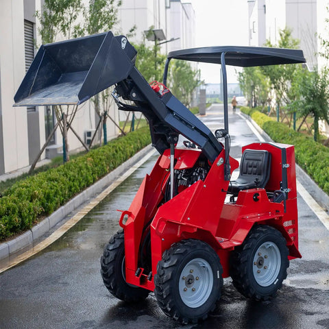 Versatile Mini Crawler Skid Steer Loader With Hydraulic Cylinder parked on a wet street, showing raised wear-resistant bucket and compact design