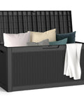 66 Gallon All Weather Outdoor Storage Box with Locking Lid for Deck Patio and Garden, containing cushions and blanket, open lid
