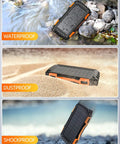 42800mAh Solar Charger Power Bank Portable Charger With USB C Input Output Dual USB Ports QC 3.0 Fast Charge External Battery Pack Built-In Super Bright Flashlight Charges Three Devices Outdoor Orange on rocks, sand, and stones.