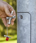 Handy Universal Control Cabinet Key for Gas, Water, and Electric Shutoff Systems in use on outdoor switchboard