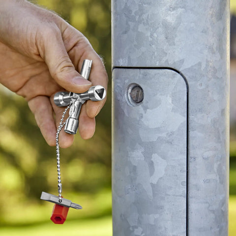 Handy Universal Control Cabinet Key for Gas, Water, and Electric Shutoff Systems in use on outdoor switchboard