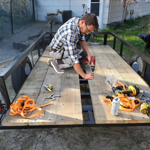 Man using Five Sixteenth Inch Thread Cutting Self Drilling Deck Screws Type Seven Star Drive on trailer decking