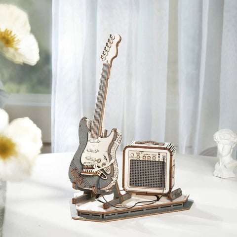 DIY Wooden Guitar Kit 3D Puzzle Craft Build Your Own Electric Guitar Model with mini amplifier on display