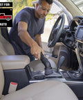 Man using Beast Tough Heavy Duty Wet Dry Vac Attachment Kit For One Seven Eighths Inch Hoses Pro Grade Shop Vacuum in car interior.