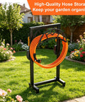 Freestanding Heavy Duty Garden Hose Holder With Upgraded Metal Stand in garden, holding orange hose, two support poles visible