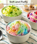 Colorful bowls of fluffy shaved ice, showcasing vibrant flavors, served with mint for a refreshing summer treat. Cool Blue 130W Electric Shaved Ice Machine And Snow Cone Maker Featuring Smart Overheat Protection And A Fast Ice Shaver With Two Bonus Ice Cups That Hit Different For Real Summer Vibes.