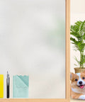 Frosted Glass Window Privacy Film Static Cling For Home And Bathroom Soft Light Diffusion UV Blocking And Anti Glare Day And Night Privacy Window Covering 17.5 Inch By 78.7 Inch displayed with installation tools and pet