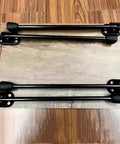 Sweet Set Of Four Portable Folding Table Legs Crafted From Skateboards And Longboards With Protective Floor Pads laid flat on a table.