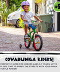 Child riding Teenage Mutant Ninja Turtles 16 Inch BMX Bike for Kids Ages 5 to 7 with purple helmet on cobblestone street.
