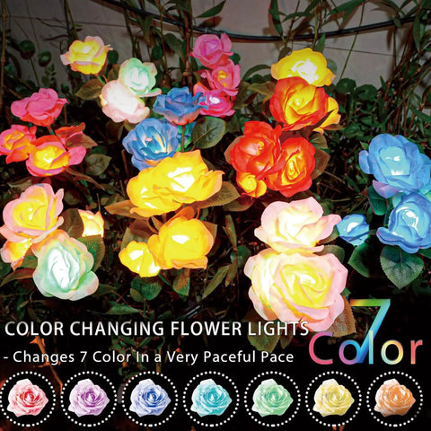 Solar Rose Garden Lights For Outdoor Decor showing 7 color-changing lit roses in various hues in a garden setting