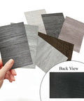 Various color samples of Self Adhesive Vinyl Floor Tiles Peel And Stick Planks in different wood grains with back view detail.