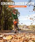 Person using Gas Powered Handheld Leaf Blower 28cc Two Stroke With 475 CFM 200 MPH Wind for clearing leaves on a road.