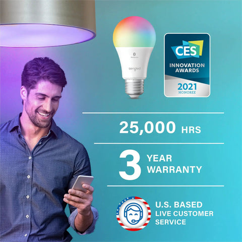 Man smiling at phone under Alexa Compatible Color Changing Smart Bulb with auto pairing and Bluetooth mesh features displayed.