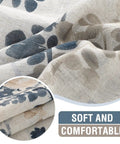 Close-up of floral linen sheer curtains fabric; bluish-taupe floral print; soft, durable linen texture