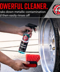 Wheel Cleaner 16oz Tough Spray For Car Wash Detailing That Destroys Brake Dust And Grime, held next to a wheel and red brush