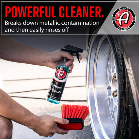 Wheel Cleaner 16oz Tough Spray For Car Wash Detailing That Destroys Brake Dust And Grime, held next to a wheel and red brush