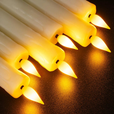 2 Pack Flameless Taper Candles With Remote And Timer, 9.6 Inch Ivory LED Battery Operated Wax Style Candles on dark surface