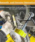 Disc Brake Pad Spreader And Caliper Piston Tool being used to compress car brake pads with solid steel build