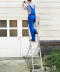7 In 1 Folding Ladder With 15 Foot Reach Aluminum Construction For Indoor And Outdoor Use Multi Position A Frame Scaffold Stairway Platform Overhang M Shape Non Slip Feet Safety Lock Heavy Duty Frame 330 Pound Capacity used as A-frame by worker outside