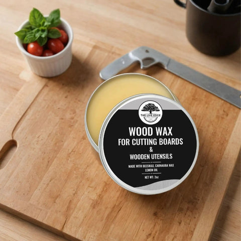 Food Grade Beeswax Wood Polish For Cutting Boards And Butcher Blocks in a round tin, placed on a wooden cutting board.