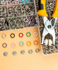 11mm Metal Snap Button Kit With Heavy Duty Press Tool Pliers 800 Pieces In 10 Colors DIY Clothes And Craft Friendly Snap Fasteners Set For Sewing Garments And Accessories displayed with colorful snaps and pliers.