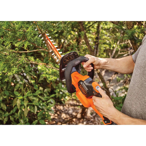 Person trimming bush with 40V MAX Cordless Hedge Trimmer With 24 Inch Dual Action Blade, No Cords Needed, Long Battery Life