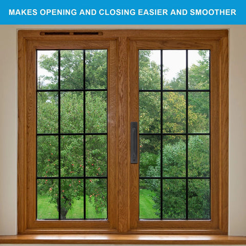 Wooden framed sliding window with black grid pattern, view of green trees outside.