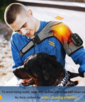 Man using Cordless Shoulder Heating Pad With Heat And Vibration while petting a dog outdoors, showing adjustable shoulder wrap.