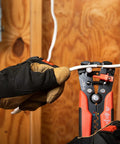 Electrician using Self-Adjusting Wire Stripper And Cutter For Electricians, 8 Inch Pro Grade Tool with ergonomic grip on wire