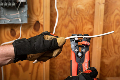Electrician using Self-Adjusting Wire Stripper And Cutter For Electricians, 8 Inch Pro Grade Tool with ergonomic grip on wire