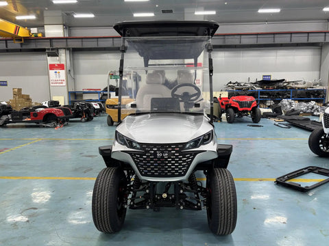Full Size Four Plus Two Seater Electric Golf Cart White featuring Macpherson Strut Independent Suspension in showroom.