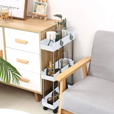 Sleek 3 Tier Slim Rolling Storage Cart With Slide Out Shelves For Tight Squeezes in pure white beside a grey chair, perfect for clutter control.