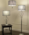 63 Inch Lady Crystal Floor Lamp With Twisted Metal Frame And Hanging Crystals, Black and White Shade, in living room setting.