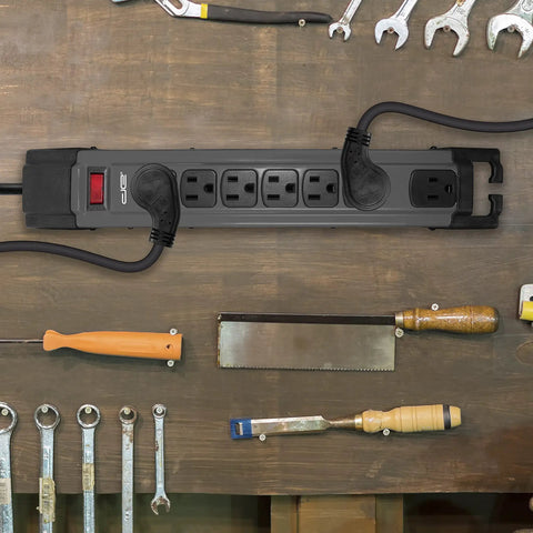 Beefy 25 Ft 7 Outlet Metal Surge Protector Power Strip With 14 AWG Cord, 1350 Joules, Flat Plug on workshop table, Grey.