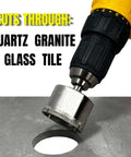 Front view of a yellow cordless drill fitted with a diamond hole saw cutting a round hole in metal.